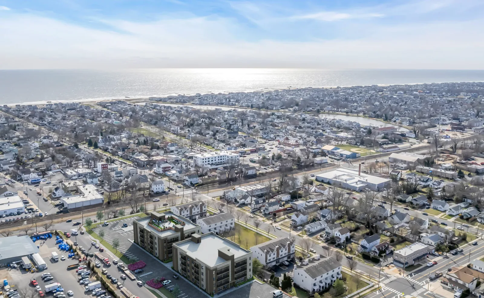 Aerial view of the 1100 Fifth Avenue condominium buildings in Neptune City, New Jersey, with the town and Atlantic Ocean beyond